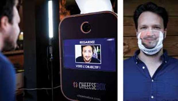 Bellefroid poses in front of a photobooth to create a face mask with a printed picture of his nose and mouth. Right: Bellefroid poses with the printed face mask.