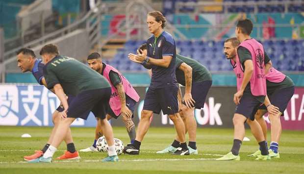 Italy coach Roberto Mancini (centre) looks on as players train yesterday in Rome, ahead of their Euro 2020 match against Turkey.  (Reuters)