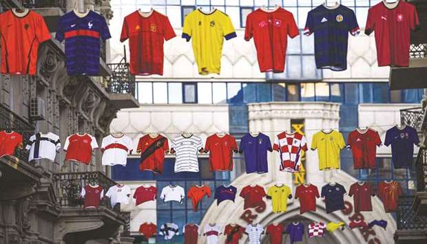 Jerseys of national teams hang in the streets of Baku, Azerbaijan, as part of promotions for the UEFA Euro yesterday. (AFP)