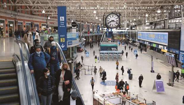 Commuters walk along the concourse after arriving at Waterloo railway station in London. The UKu2019s overall output for April remains 3.7% below pre-pandemic levels seen in February last year.