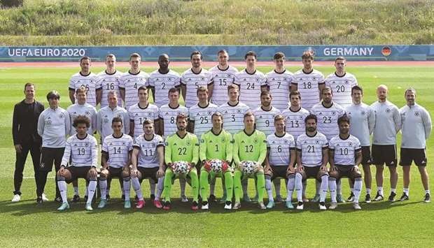 Germanyu2019s players and support staff pose for a picture before a training session in Herzogenaurach, Germany, yesterday. (AFP)