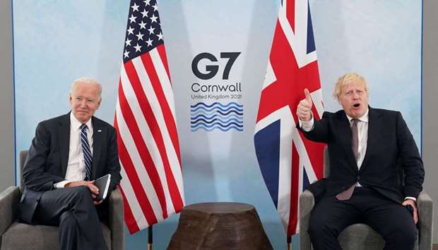 Britain's Prime Minister Boris Johnson gives a thumb up as US President Joe Biden looks on during their meeting, ahead of the G7 summit, at Carbis Bay, Cornwall, Britain
