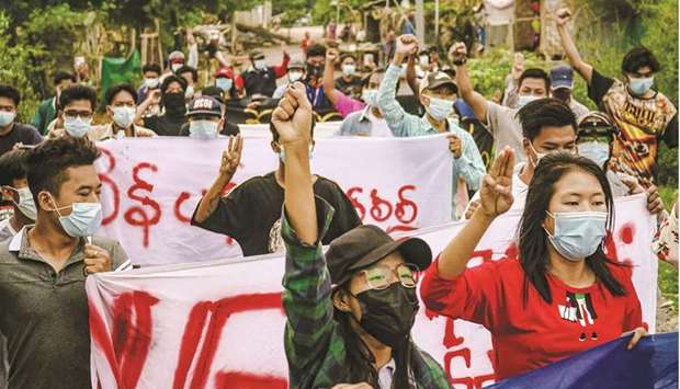 Protesters marching during a demonstration against the military coup in Mandalay.