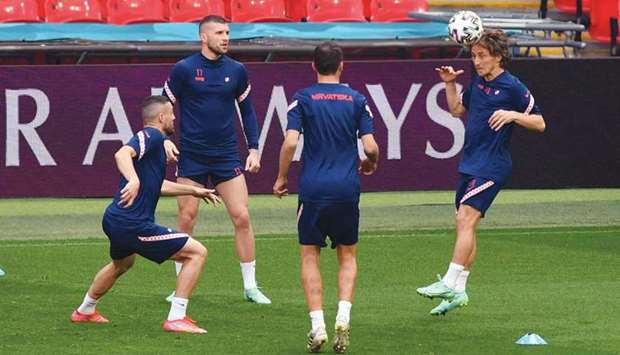 Croatiau2019s Luka Modric (right) trains with teammates at Wembley Stadium in London yesterday, on the eve of the UEFA EURO 2020 match against England.(AFP)