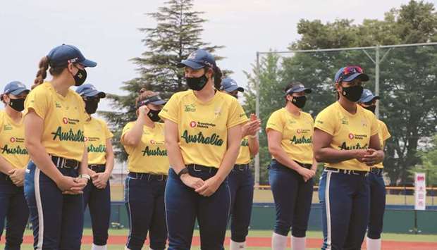 In this June 7, 2021, picture, members of Australiau2019s Olympic softball squad listen to the mayor of Ota city, Masayoshi Shimizu, a stadium in Ota, Japan. (Reuters)