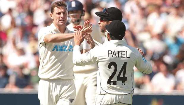 New Zealandu2019s Matt Henry (left) celebrates with teammates after taking the wicket of Englandu2019s Dom Sibley during the Second Test at the Edgbaston Stadium in Birmingham, Britain, yesterday. (Reuters)
