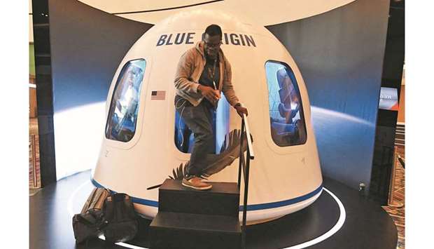 In this file photo taken on June 5, 2019, participants leave the Blue Origin Space Simulator during the Amazon Re:MARS conference on robotics and artificial intelligence at the Aria Hotel in Las Vegas, Nevada. (AFP)