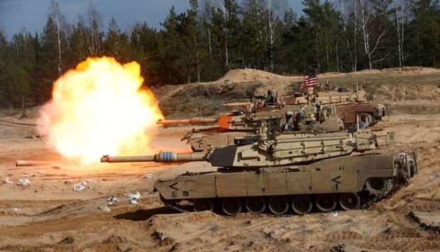 US Army M1A1 Abrams tank fires during NATO enhanced Forward Presence battle group military exercise Crystal Arrow 2021 in Adazi, Latvia on March 26. REUTERS