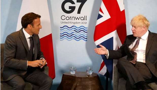 Britain's Prime Minister Boris Johnson and France's President Emmanuel Macron take part in a bilateral meeting during the G7 summit in Carbis bay, Cornwall