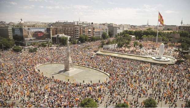 People demonstrate against a plan by the Spanish government to concede pardon to the Catalan politicians who promoted a failed independence declaration of the region in 2017, at Colon Square in Madrid, Spain, yesterday. (Reuters)