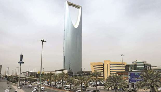 Cars drive past the Kingdom Centre Tower in Riyadh (file). Saudi Arabiau2019s non-oil economy, the kingdomu2019s engine of job creation, grew at its fastest pace since 2019 in the first quarter, the government reported, though the expansion was slightly slower than preliminary estimates.