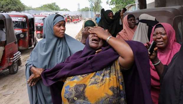 A woman reacts after receiving the confirmation that her son was killed in a suicide bombing attack on a military base, at the Madina Hospital in Mogadishu, Somalia. REUTERS