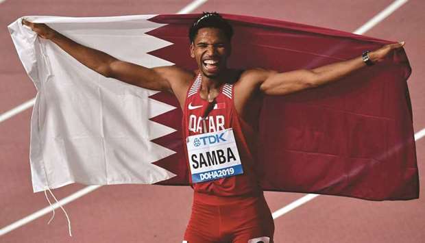 This file photo taken at the Khalifa International Stadium in Doha on September 30, 2019 shows Qataru2019s Abderrahman Samba celebrating after winning bronze in the 400m hurdles at the IAAF Athletics World Championships.