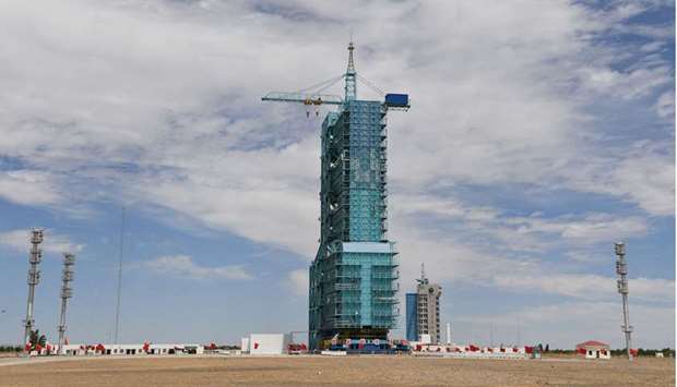 A Long March-2F carrier rocket, carrying the Shenzhou-12 spacecraft for China's first crewed mission to its new space station, scheduled for June 17, sits on the launch pad encased in a shield at the Jiuquan Satellite Launch Centre in the Gobi desert in northwest China