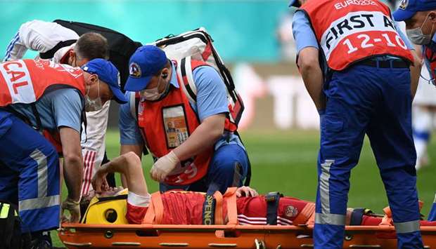 Russia's defender Mario Fernandes is stretchered off injured during the Euro 2020.