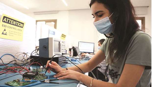 Multilane companyu2019s staff work on a circuit board at Houmal technology park in Houmal, Lebanon. It produces testing and measurement equipment for data centre infrastructure, and its international clients include Microsoft, Apple, and Google.