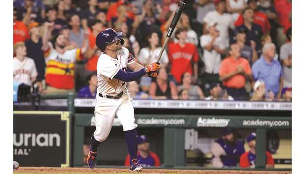 Jose Altuve of the Houston Astros hits a grand slam to defeat the Texas Rangers during the tenth inning by a score of 6-3 at Minute Maid Park in Houston, Texas. (Getty Images/AFP)