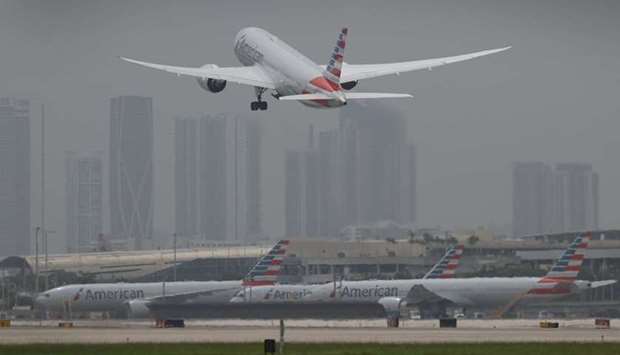 An American Airlines plane takes off at the Miami International Airport in Miami, Florida.