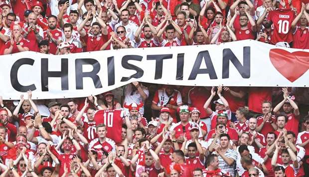 Denmark fans show support for Christian Eriksen during their teamu2019s match against Belgium in Copenhagen yesterday. (Reuters)