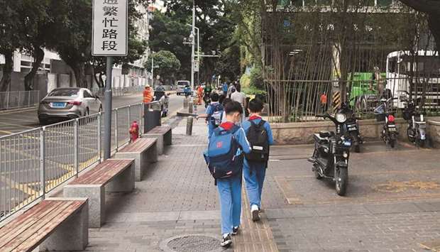 Children leave a school in the Shekou area of Shenzhen, Guangdong province. China is poised to unveil a much tougher than anticipated crackdown on the countryu2019s $120bn private tutoring industry, four sources told Reuters, including trial bans on vacation tutoring and restrictions on advertising.