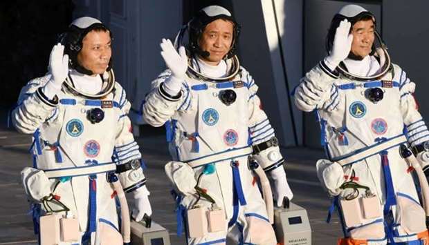 The first Tiangong crew includes astronauts Nie Haisheng (center), Liu Boming (right) and Tang Hongbo. (AFP)