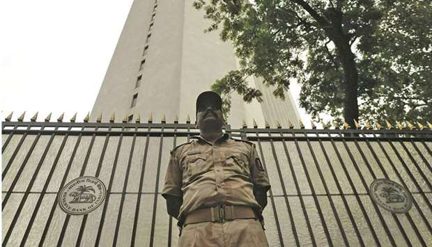 A security guard stands outside the Reserve Bank of India headquarters in Mumbai. The inflation shock is adding to uncertainty on whether the RBI would stick to its pledge of keeping policy accommodative to support the economy.