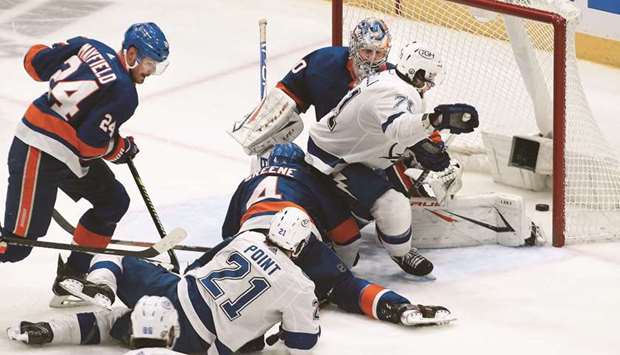 Tampa Bay Lightningu2019s Brayden Point (21) scores the game winning goal against New York Islanders during the second period in game three of the 2021 Stanley Cup Semi-finals at Nassau Veterans Memorial Coliseum in Uniondale, New York, United States on Thursday. (USA TODAY Sports)