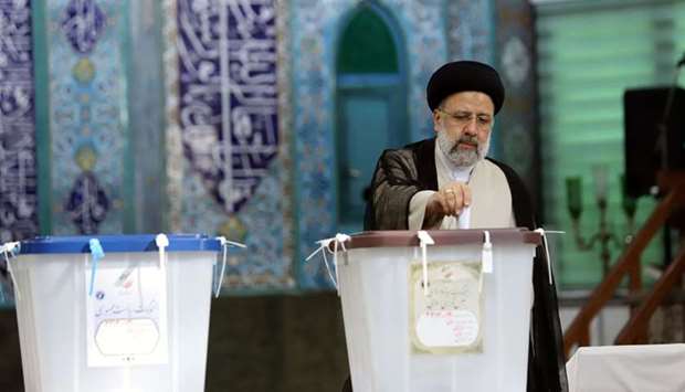 Presidential candidate Ebrahim Raisi casts his vote during presidential elections at a polling station in Tehran, Iran