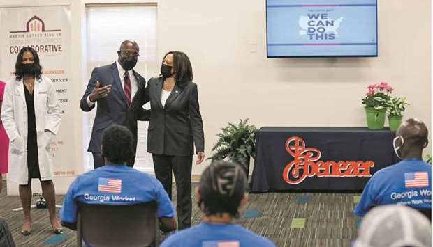 US Senator Raphael Warnock speaks next to Vice President Kamala Harris while Dr Jayne Morgan, executive director of the Covid Task Force at the Piedmont Healthcare Corporation, looks on during a visit to a pop-up Covid-19 vaccination site at Ebenezer Baptist Church, in Atlanta, Georgia, US, yesterday.