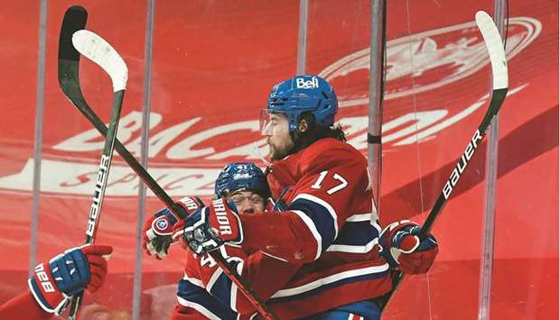 Josh Anderson (right) of the Montreal Canadiens is congratulated by Paul Byron after scoring the game-winning goal against the Vegas Golden Knights during the first overtime period in Game Three of the Stanley Cup Semi-finals at Bell Centre in Montreal. (Getty Images/AFP)