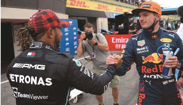 Red Bullu2019s Max Verstappen (right) is congratulated by Mercedesu2019 Lewis Hamilton after the former took pole position for the French Grand Prix at Circuit Paul Ricard in Le Castellet, France, yesterday. (Reuters)
