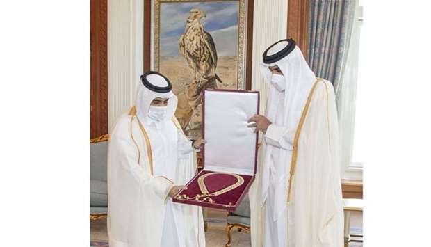 His Highness the Amir Sheikh Tamim bin Hamad Al-Thani awards the Hamad bin Khalifa Sash to HE Dr. Ali bin Fetais Al Marri