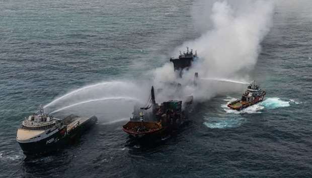 Smoke rises from a fire onboard the MV X-Press Pearl vessel in the seas off the Colombo Harbour