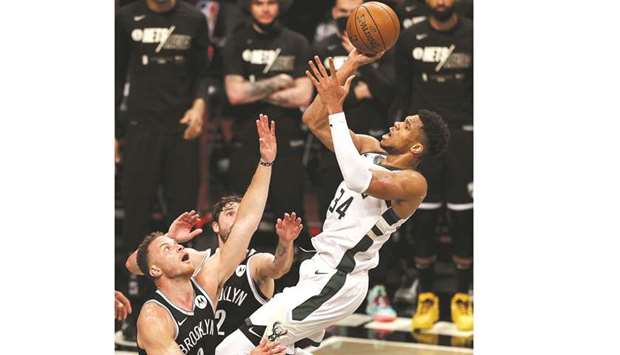 Giannis Antetokounmpo of the Milwaukee Bucks heads for the net as Blake Griffin (left) of the Brooklyn Nets and Joe Harris of the Brooklyn Nets defend during game seven of the Eastern Conference second round at Barclays Center in the Brooklyn borough of New York City. (Getty Images/AFP)