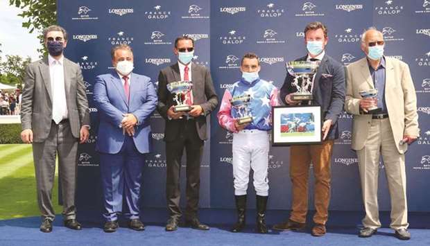 Qataru2019s ambassador to France Sheikh Ali bin Jassim al-Thani (second from left) and France Galop President Edouard de Rotshchild (left) presented the trophies to the winners of Qatar Derby des Pur-Sang Arabes de 4 Ans (Group 1 PA) in Chantilly, France, yesterday.