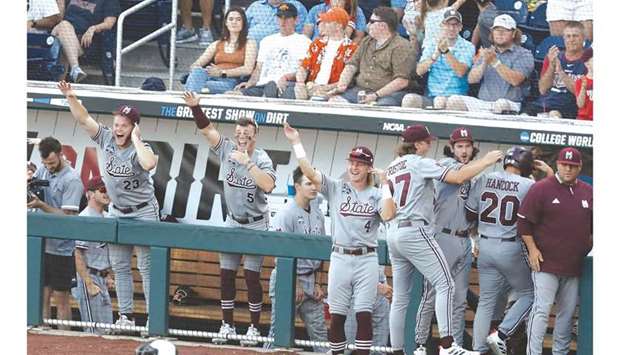 Mississippi State Bulldogs celebrate Luke Hancocku2019s (second from right) run against the Texas Longhorns in the NCAA College World Series in Omaha, Nebraska, United States, on Sunday. (USA TODAY Sports)