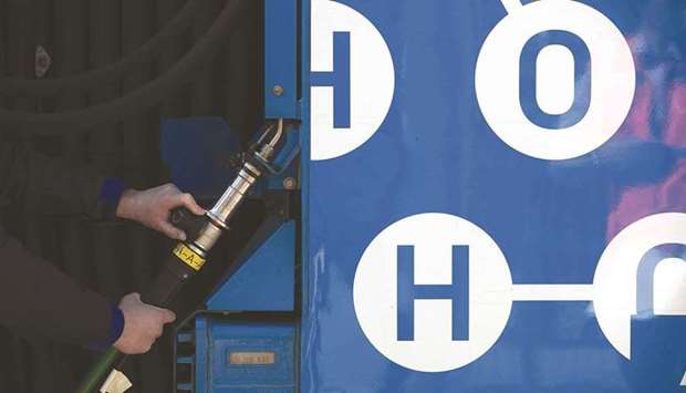 A worker refuels a hydrogen fuel cell-powered prototype railway train at a refuelling station in Salzgitter, Germany (file). In April, Reliance helped set up India H2 Alliance, a new energy transition coalition for commercialising hydrogen technologies, a cleaner alternative to fossil fuels.