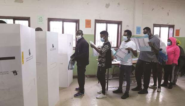 People queue at a polling station to vote during the Ethiopian parliamentary and regional elections, in Addis Ababa, yesterday.