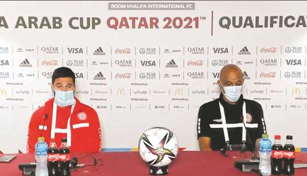 Lebanon coach Jamal Taha (right) and Hassan Maatouk attend a press conference on Tuesday.