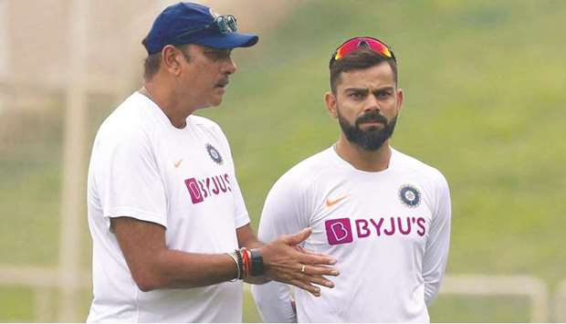Indiau2019s coach Ravi Shastri (left) and captain Virat Kohli.