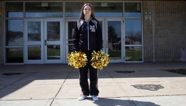 (File photo) Brandi Levy wears her former cheerleading outfit outside Mahanoy Area High School in Mahanoy City, Pa., on April 4. (Reuters)