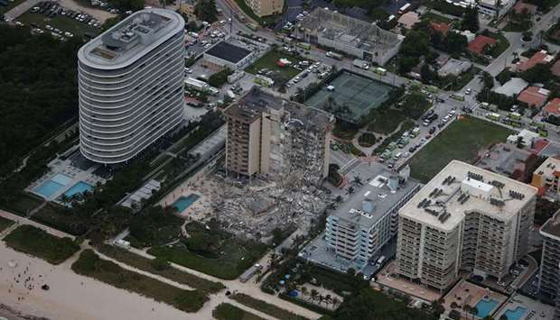 Search and rescue personnel work in the rubble of the 12-story condo tower that partially collapsed on June 24, 2021 in Surfside, Florida.