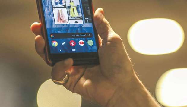 A smartphone displays application icons for Google Chrome, Pinterest, YouTube and WhatsApp in an arranged photograph. Google is working with the ad industry on technologies that could replace the tracking capabilities of cookies while better protecting online privacy.