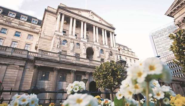 A view of the Bank of England in London. The BoEu2019s nine monetary policymakers voted 8-1 again yesterday to keep their government bond-buying programme at u00a3875bn ($1.22tn).