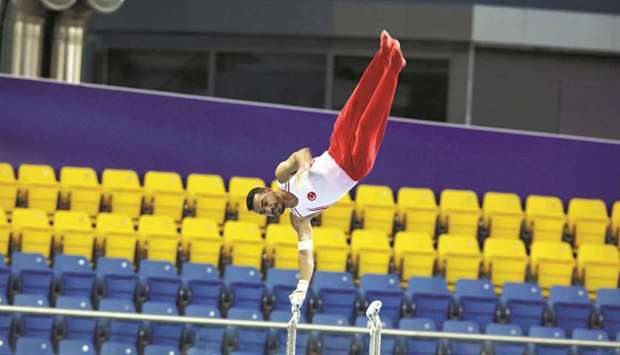 Turkeyu2019s Ferhat Arican in action on horizontal bar during the 13th Artistic Gymnastics World Cup at the Aspire Dome yesterday.