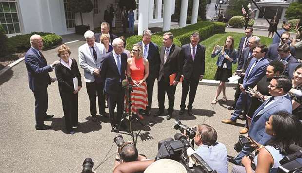 Biden speaks to the media outside the White House after a meeting with a bipartisan group of senators on infrastructure negotiations.