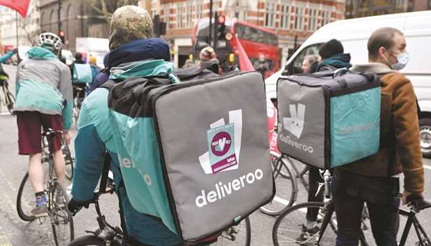 This picture taken earlier this year shows Deliveroo riders in London pushing for improved working conditions.