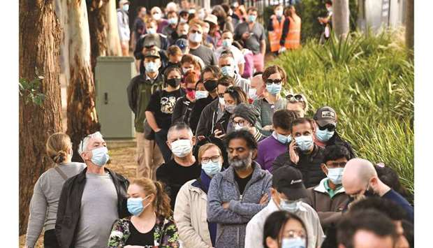 Residents queue outside a vaccination centre in Sydney yesterday as they were largely banned from leaving the city to stop a growing outbreak of the highly contagious Delta Covid-19 variant spreading to other regions.