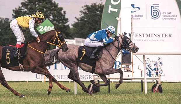 Konrad Mazur (right) rides Nrgizing to victory in the El Paso Stakes in Warsaw, Poland