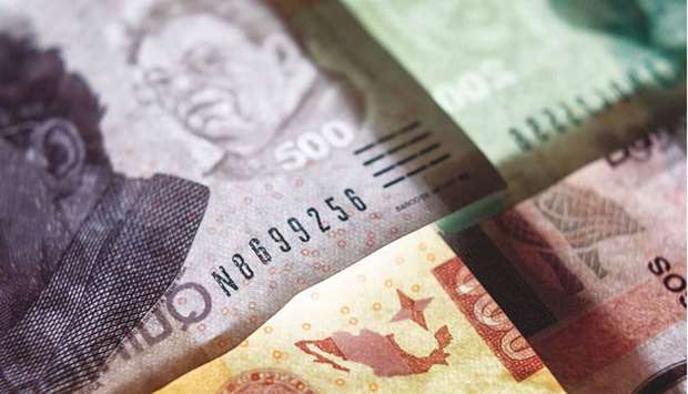 Mexican peso banknotes are arranged for a photograph in San Luis Potosi, Mexico. The race to top of the emerging-market currency pack will be determined by central banks that are taking no chances with inflation. Recent winners are the Mexican peso, Brazilian real and Hungaryu2019s forint u2013 currencies whose central banks raised rates this month, protecting their relative yield advantage against accelerating prices and the prospect of rising US rates.